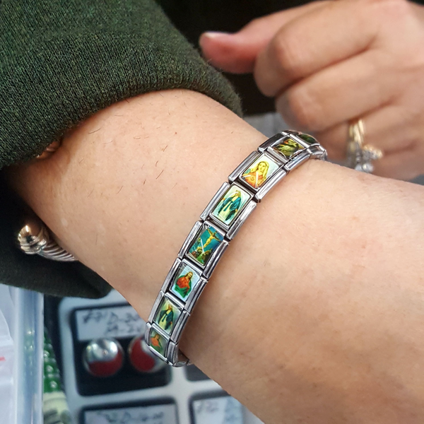 4-4214-h3 Stainless Steel Saints Stretch Bracelet for Women, fitted.